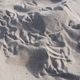 motyw obowiązkowy: ślady na piasku